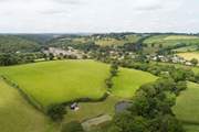 A bird's eye view looking down at Shepherd's Rest with the village of Lerryn in the background.
