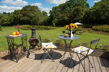 The lovely decked-area has plenty of room for al fresco dining with a chiminea too.