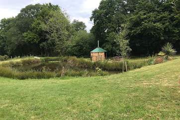 Just beyond the lake is your rustic, hand crafted barbecue hut!