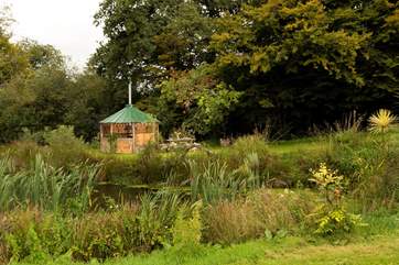 Just beyond the lake is your rustic, hand crafted barbecue hut!