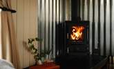 On cooler days get cosy by the wood burner.  - Thumbnail Image