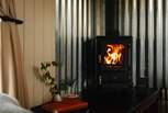On cooler days get cosy by the wood burner. 