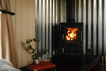 On cooler days get cosy by the wood burner.