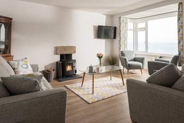 Enjoy watching the dancing flames from the comfortable sofas, there is room for everyone.