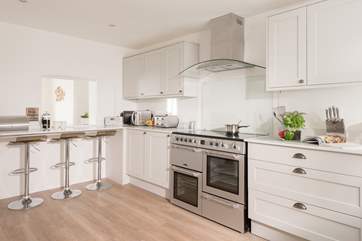 The modern and stylish kitchen has views to the sea too.