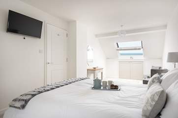 The large master bedroom on the third floor is a calm space to relax (Bedroom 4).