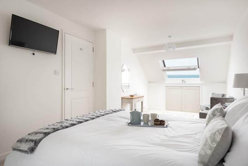 The large master bedroom on the third floor is a calm space to relax (Bedroom 4).