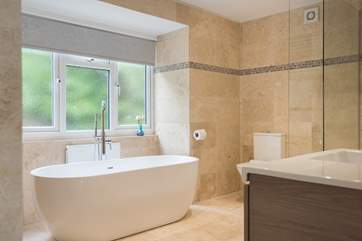 This luxurious bath is just waiting to be filled with bubbles.