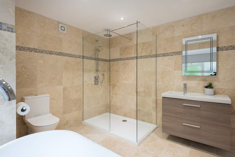There is a large walk-in shower in this first floor bathroom.