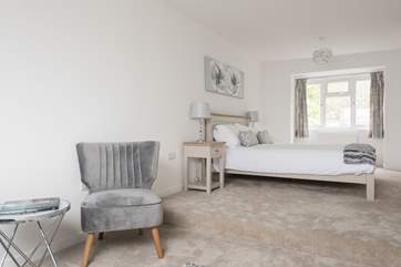 A small step separates the bedroom-area from the private sitting-area in the master bedroom.