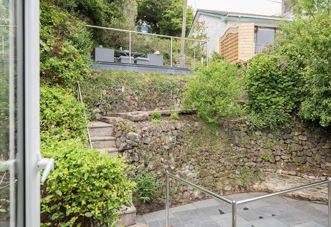 The terrace garden to the rear with steps up to your car parking space at the top.