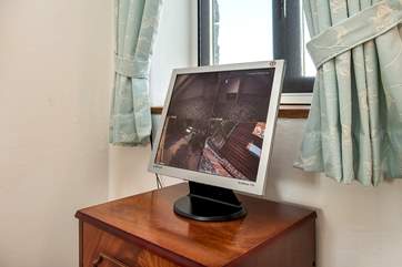 You can watch the comings and goings of the owls on the monitor in Bedroom 3.