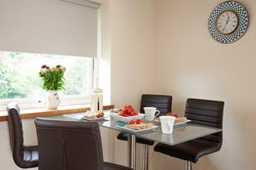 The kitchen/diner has a lovely dining-table to enjoy mealtimes.