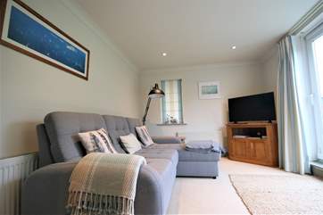 The sitting-room is spacious, light and comfortable.