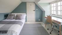 Bedroom 3 is light and airy, furnished with a desk, this is a great spot to catch up on those demanding emails.