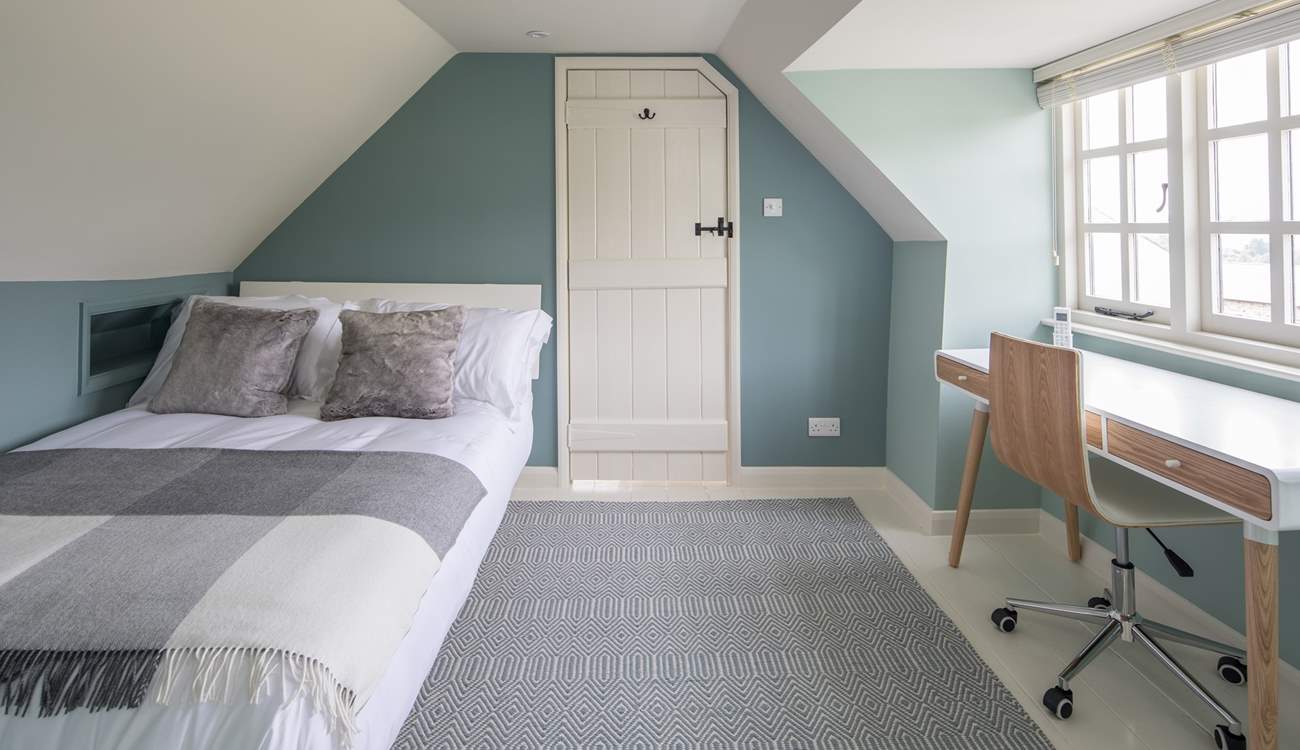 Bedroom 3 is light and airy, furnished with a desk, this is a great spot to catch up on those demanding emails.