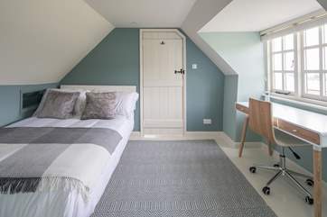 Bedroom 3 is light and airy, furnished with a desk, this is a great spot to catch up on those demanding emails.