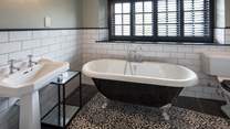 The en suite to the master bedroom comprises of a superb roll-top bath and luxury shower cubicle.