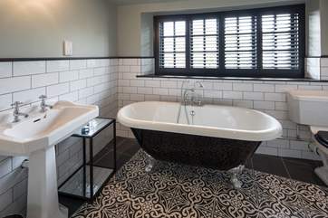 The en suite to the master bedroom comprises of a superb roll-top bath and luxury shower cubicle.
