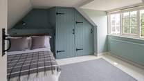 Bedroom 4 is lovingly furnished and overlooks the picture-perfect church.