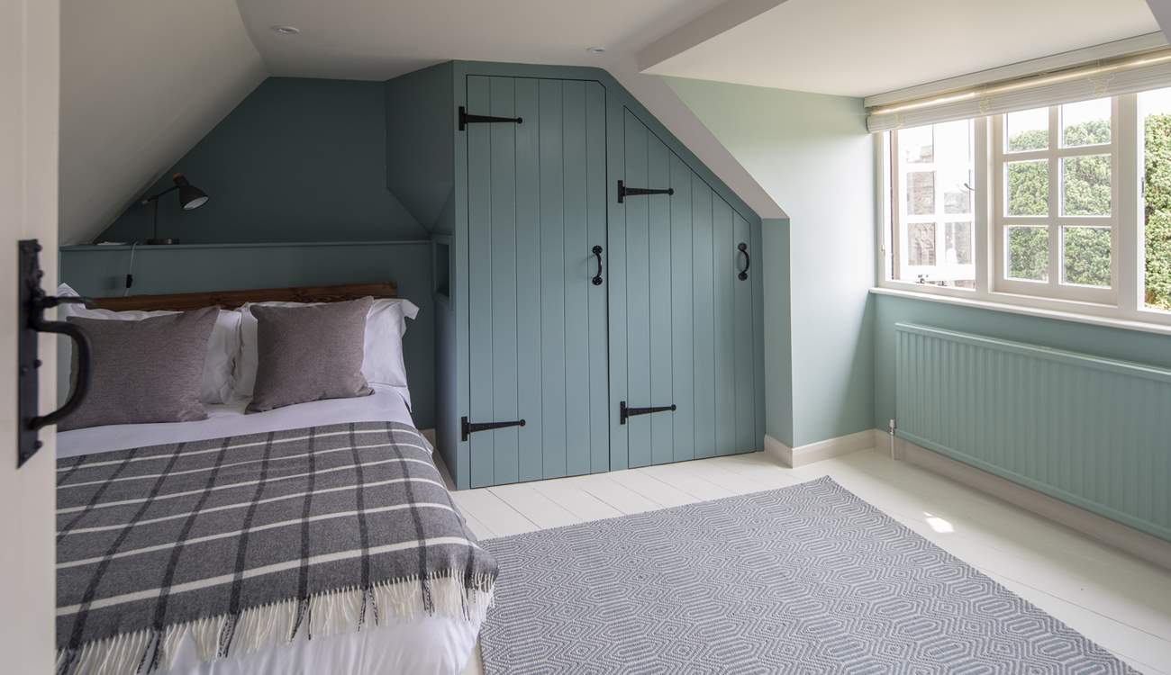 Bedroom 4 is lovingly furnished and overlooks the picture-perfect church.