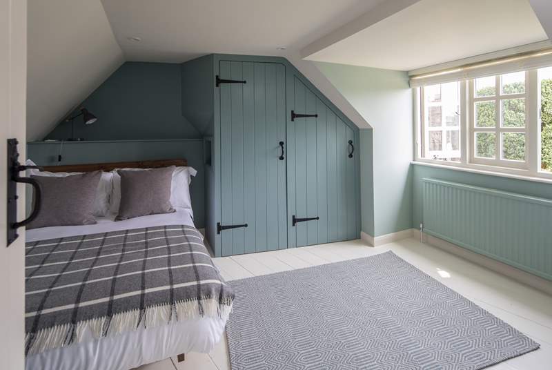 Bedroom 4 is lovingly furnished and overlooks the picture-perfect church.