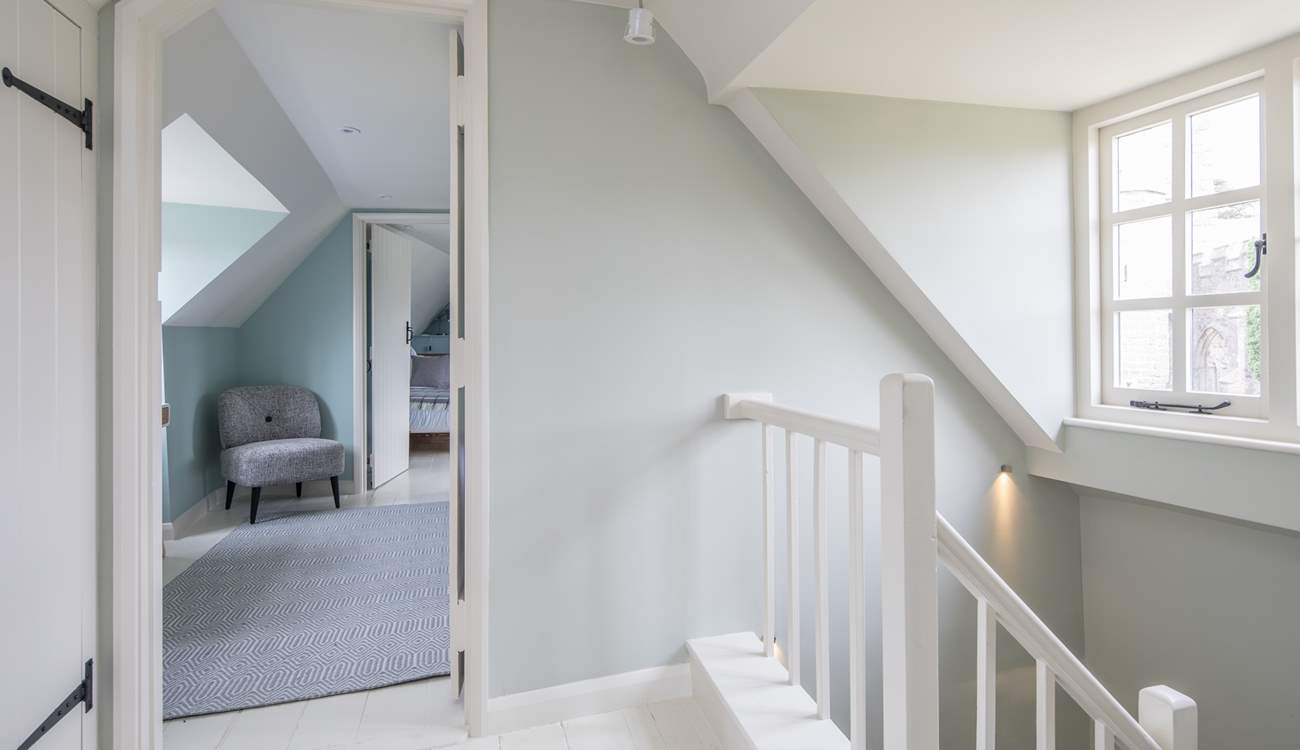 The stairs wind up from the ground floor, through the first floor and deliver you on the hallway on the second floor.