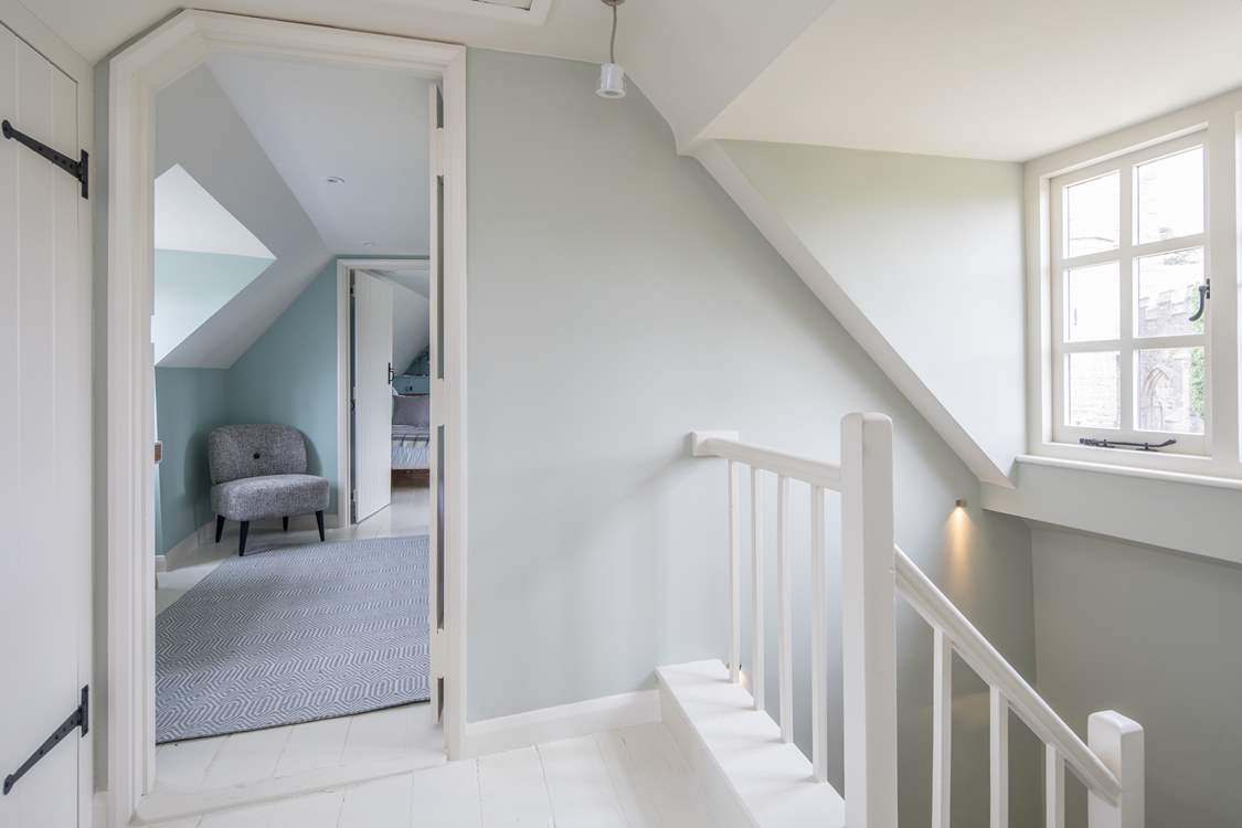 The stairs wind up from the ground floor, through the first floor and deliver you on the hallway on the second floor.