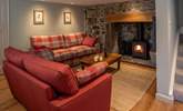 The cosy sitting-room is such a great place to snuggle up and relax following an action-packed day. - Thumbnail Image