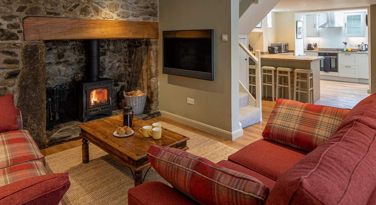 Looking through to the kitchen, past the Bang & Olufsen TV. No expense has been spared in this beautiful cottage.