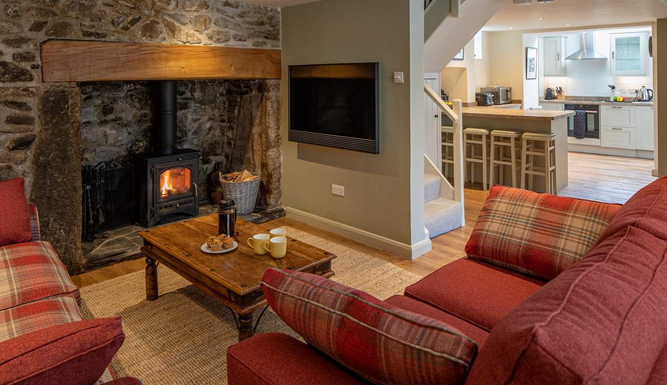 Looking through to the kitchen, past the Bang & Olufsen TV. No expense has been spared in this beautiful cottage.