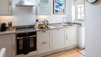 The kitchen is carefully designed and fully equipped to make whipping up a feast a doddle.