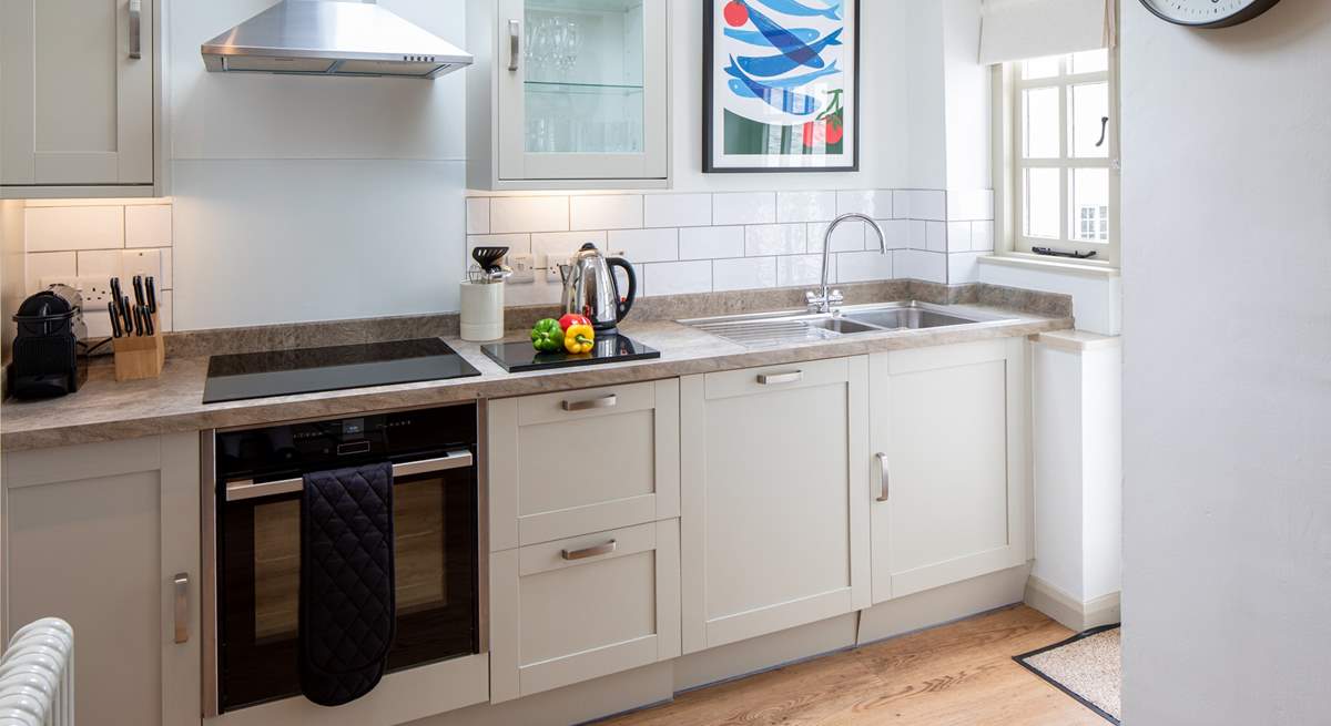 The kitchen is carefully designed and fully equipped to make whipping up a feast a doddle.