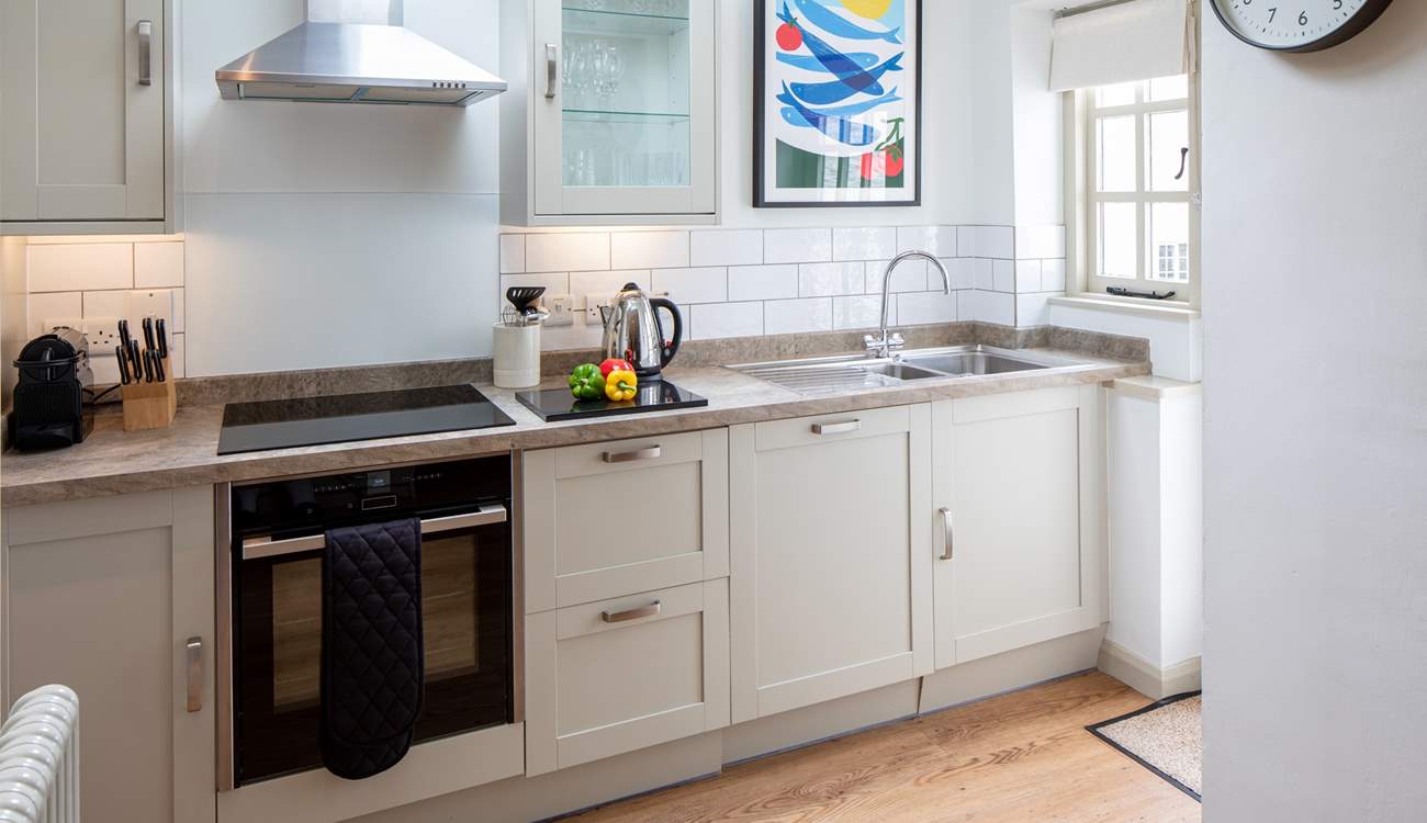 The kitchen is carefully designed and fully equipped to make whipping up a feast a doddle.