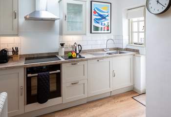 The kitchen is carefully designed and fully equipped to make whipping up a feast a doddle.