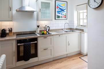 The kitchen is carefully designed and fully equipped to make whipping up a feast a doddle.