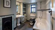The family bathroom boasts a lovingly restored fireplace. What a stunning piece of history.