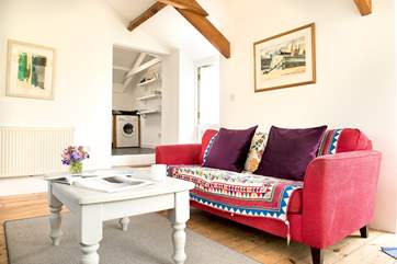 There are a couple of steps from the sitting-area up to the kitchen.
