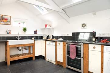 Slate floors and the exposed A frames add to the overall charm of the barn.