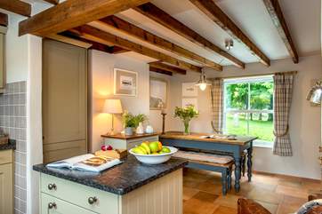 The moveable island divides the kitchen from the dining-area.