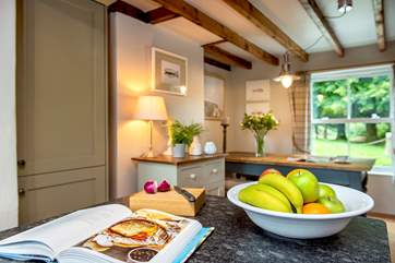 The dining area is at the far end of the kitchen