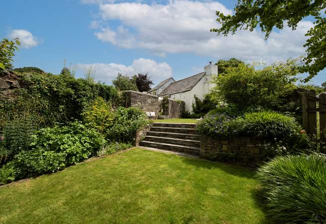 Plenty of room for fun and games on the lawns which spread over two tiers. (please take care with children around the steps)
