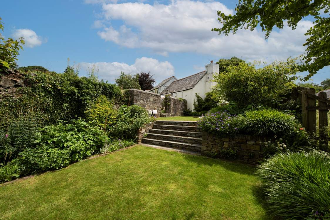 Plenty of room for fun and games on the lawns which spread over two tiers. (please take care with children around the steps)
