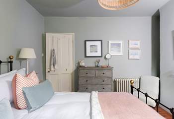 Luscious linens, plump cushions and gorgeous throws adorn the bed.