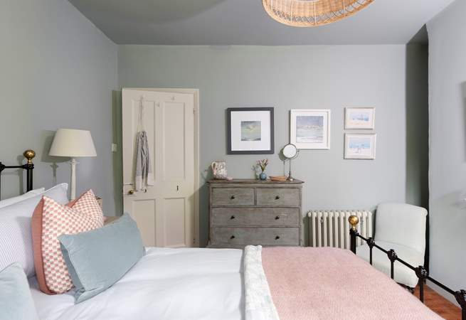 Luscious linens, plump cushions and gorgeous throws adorn the bed.