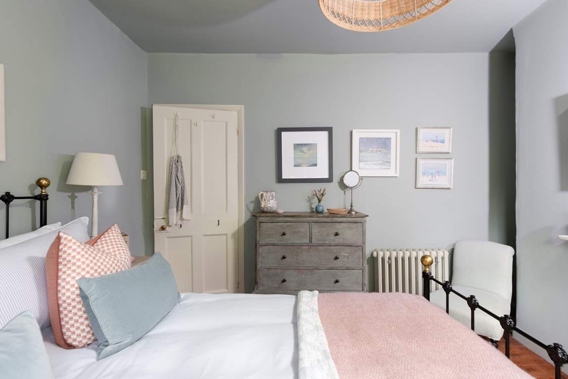 Luscious linens, plump cushions and gorgeous throws adorn the bed.