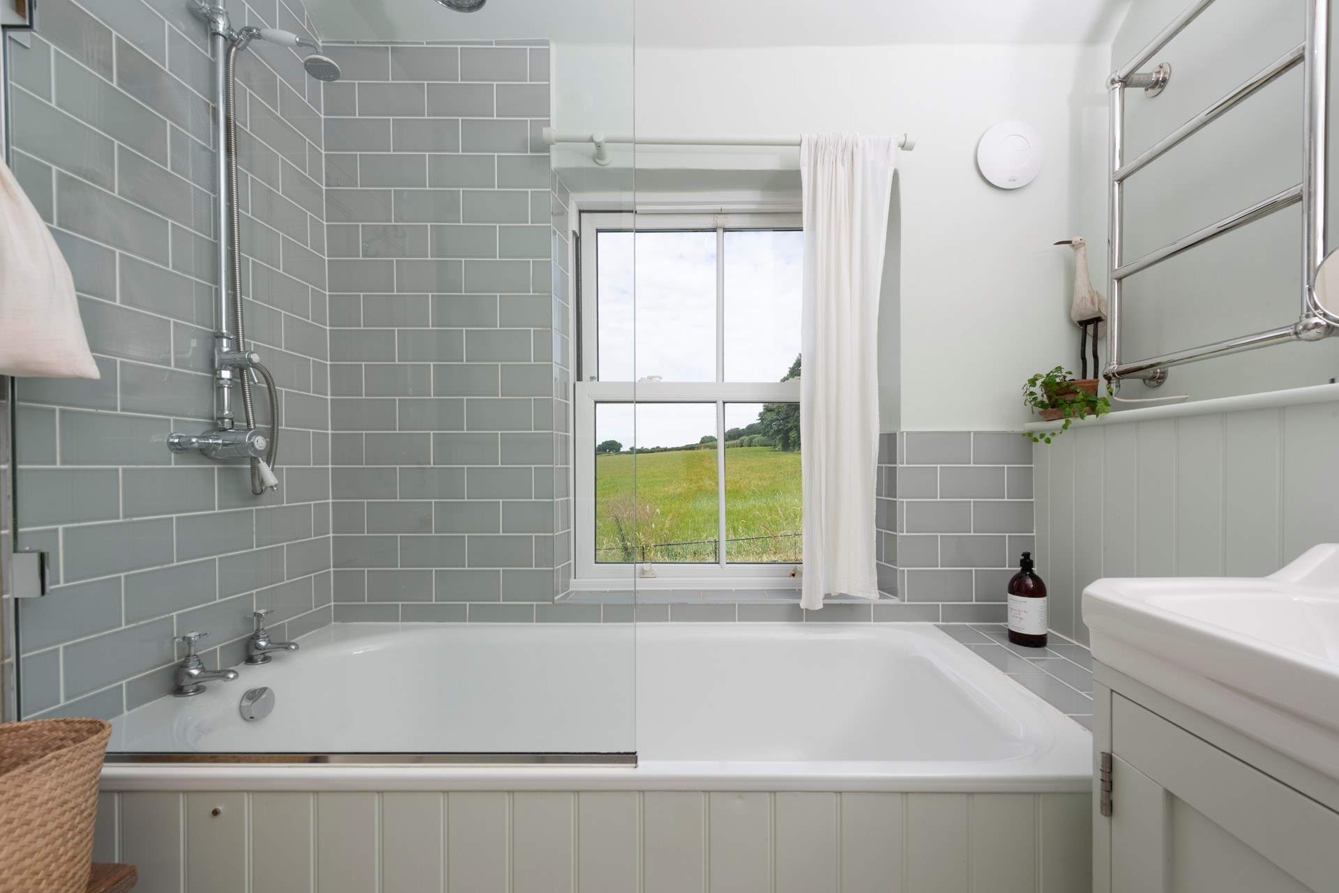 The family bathroom enjoys views across the Cornish countryside.