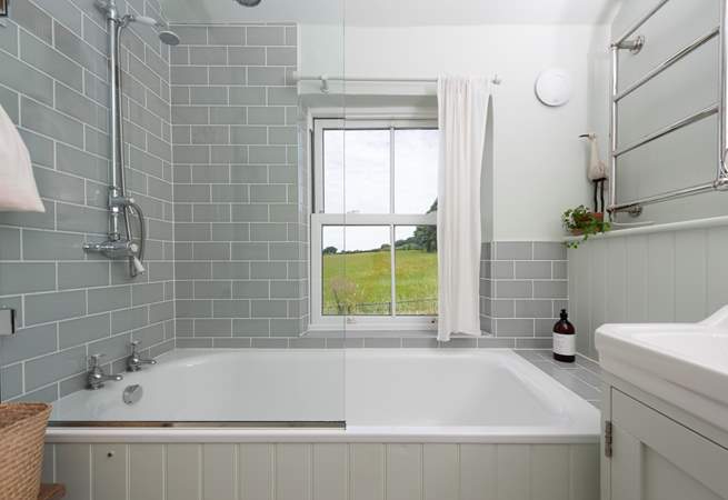 The family bathroom enjoys views across the Cornish countryside.