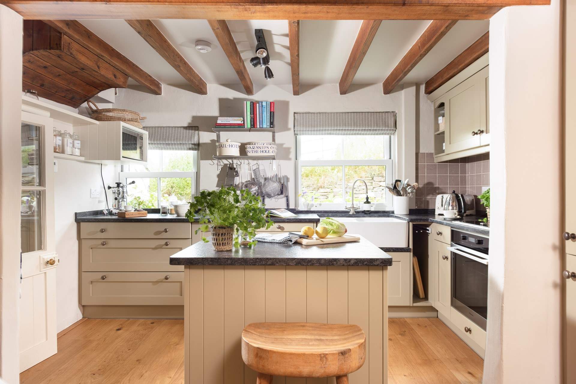 The moveable island divides the kitchen from the dining-area.
