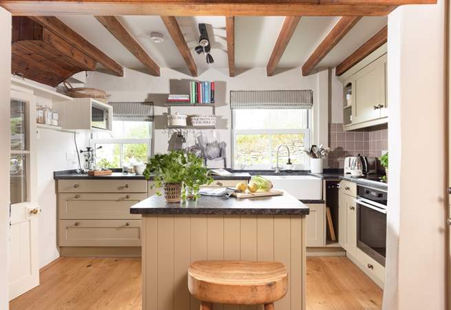 The moveable island divides the kitchen from the dining-area.